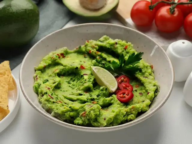 Bowl of guacamole with lime