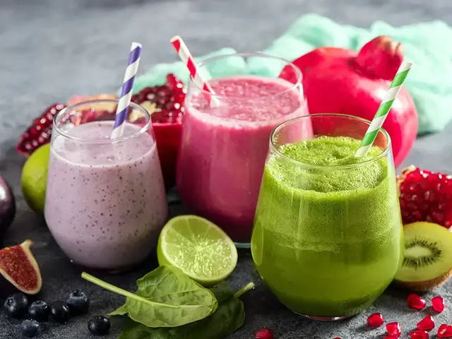 Glasses of fruit and green smoothies
