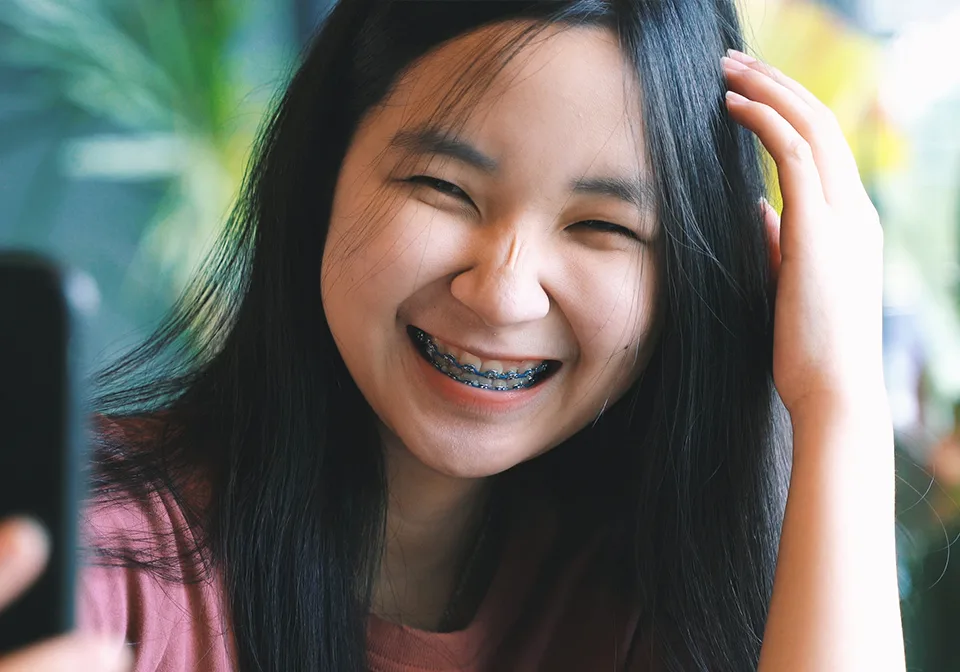 Smiling teenager with braces