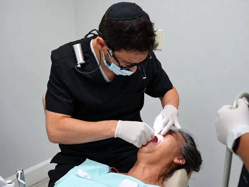 Dentist treating a patient at Atlantic Dental & Orthodontics