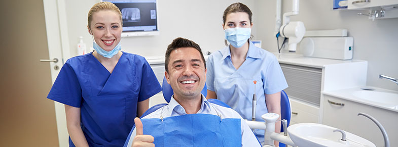 Dental Patient Giving a Thumbs Up for his New Dental Implants